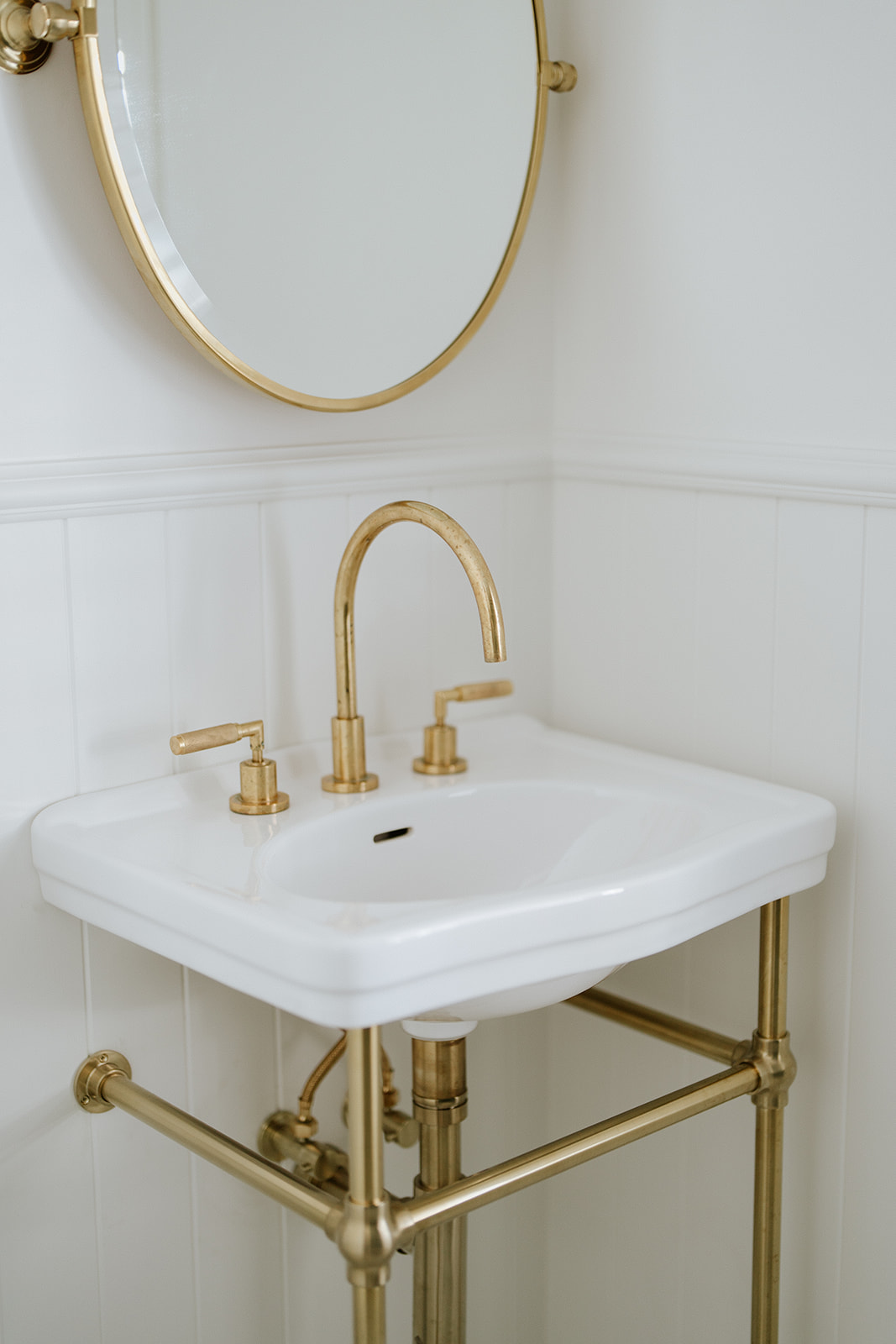 Gold Tapware with sink and mirror